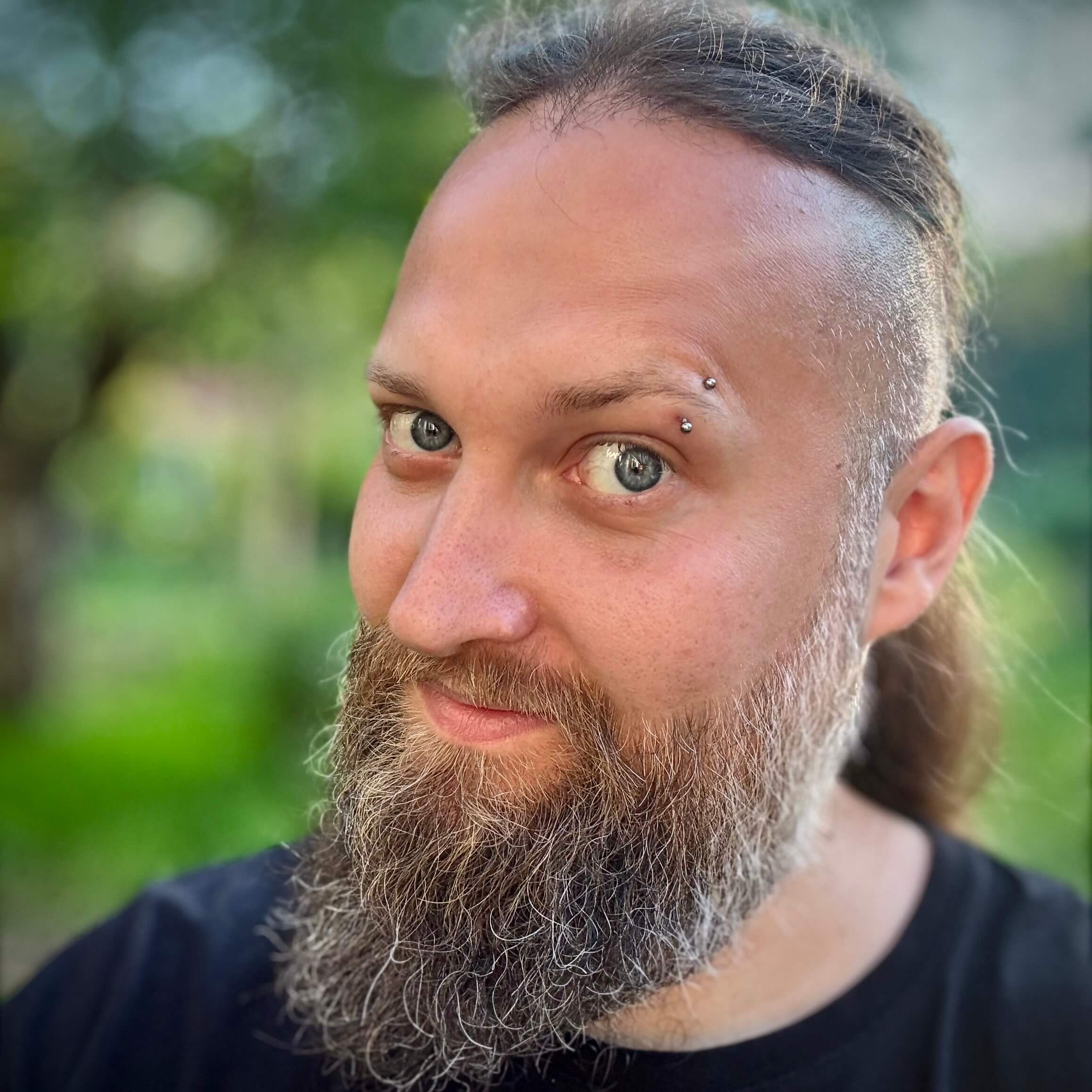 Portrait of Muzzug, the developer behind Wyrmframe
